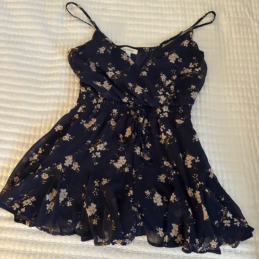 Francesca’s flower romper blue with white flowers